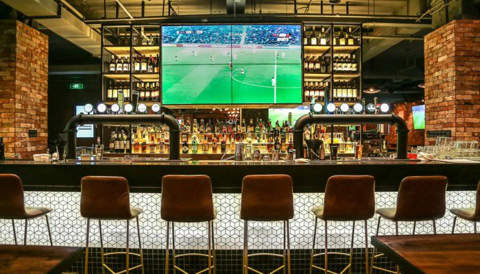 sports bar in medellin with soccer game on TV