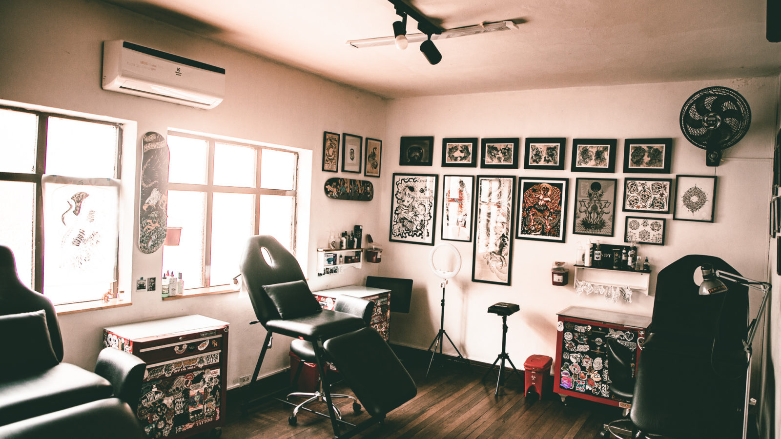 tattoo room with designs on the walls