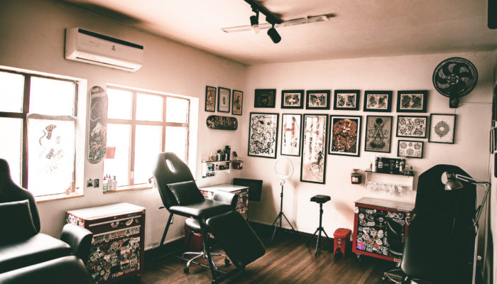 tattoo room with designs on the walls