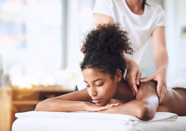 Shot of a young woman getting a massage at a spa